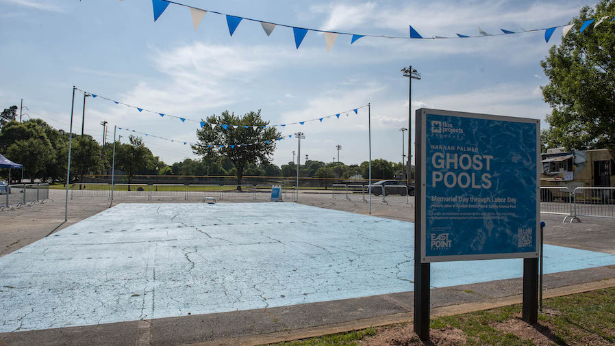 Photo of Ghost Pools, Randall Street location showins the blue pool, diving bards, and flags